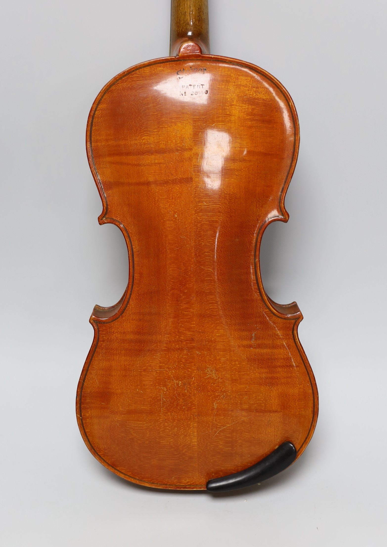 An early 20th century Stainer violin, patent number 23140, back measures 36.5cm excl button. cased